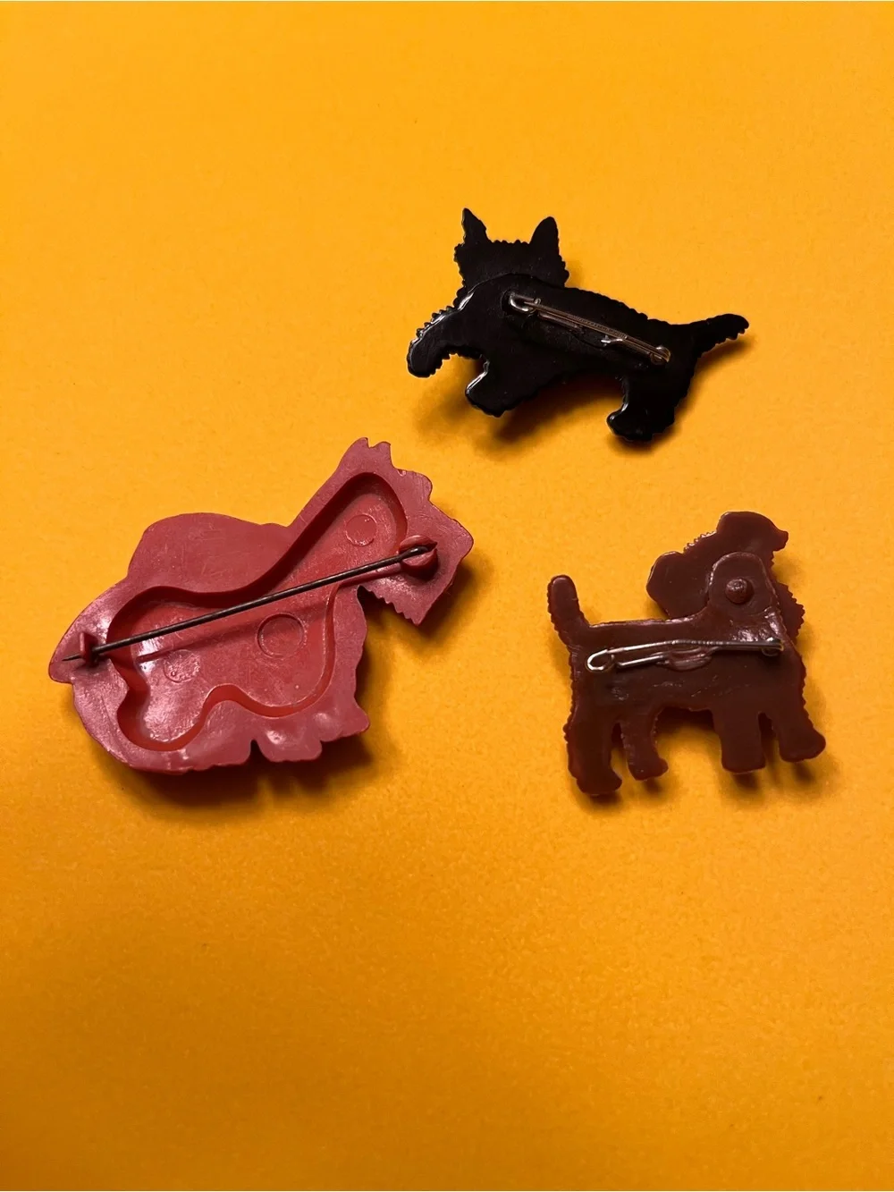 Three Terrier Celluloid and Bakelite Pins (1930-1950)